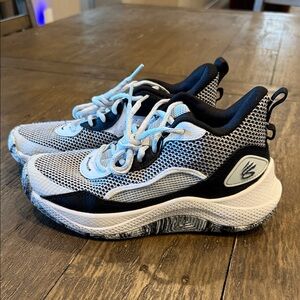 Curry Under Armour Kids Black and White basketball shoes.  5.5Y